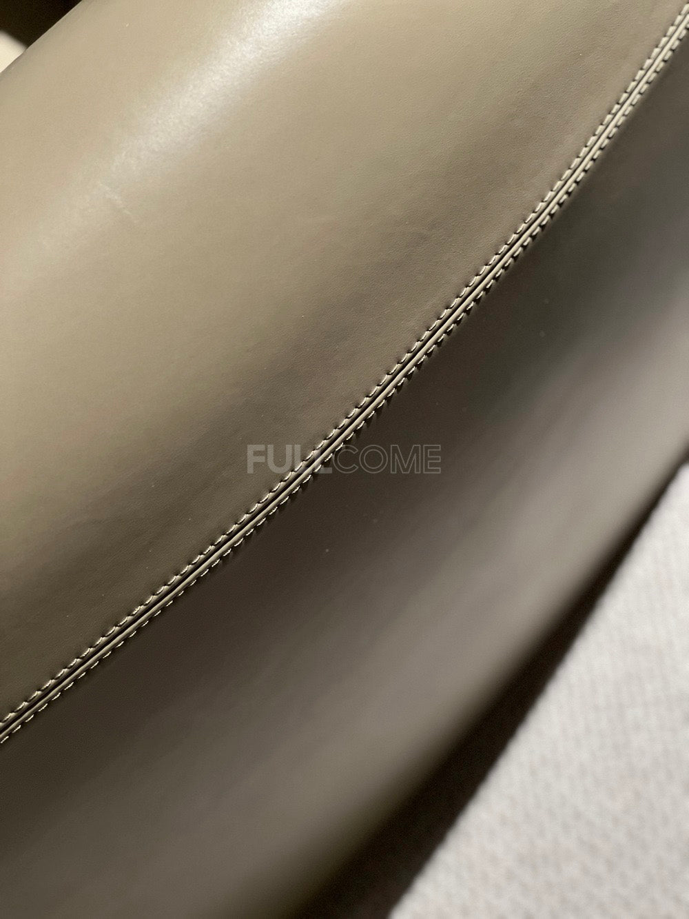 The Plunge Arm Lounge Chair