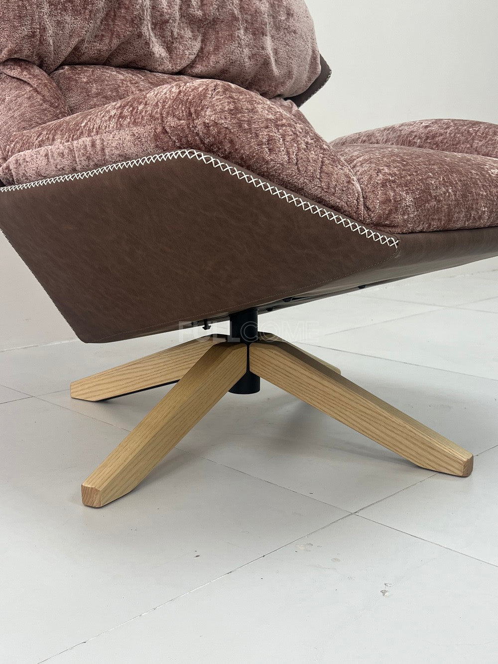 The Rivet Rim Swivel Chair