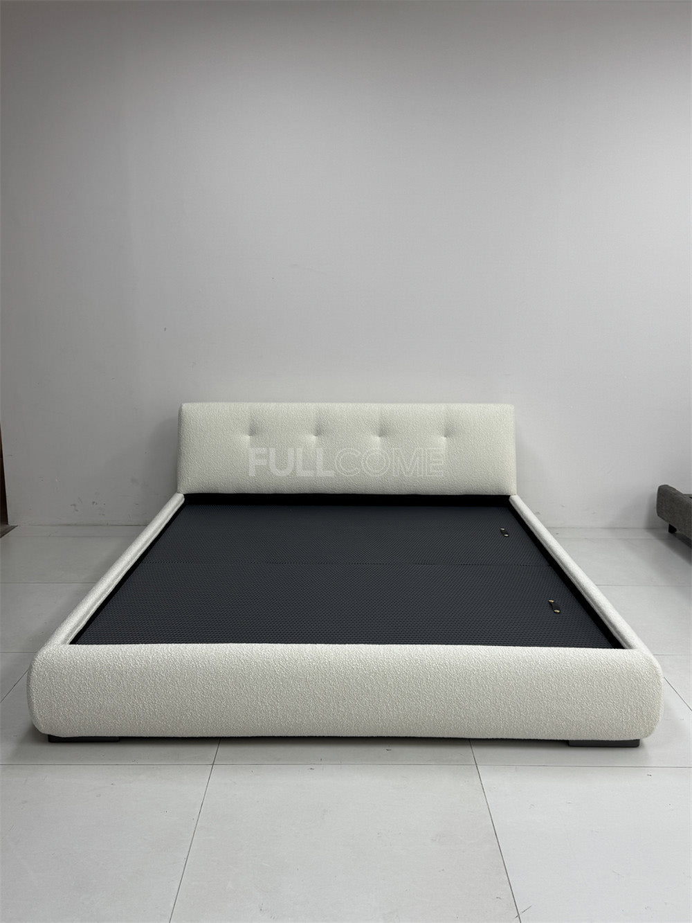 The Buttoned Boucle Platform Bed