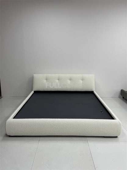 The Buttoned Boucle Platform Bed