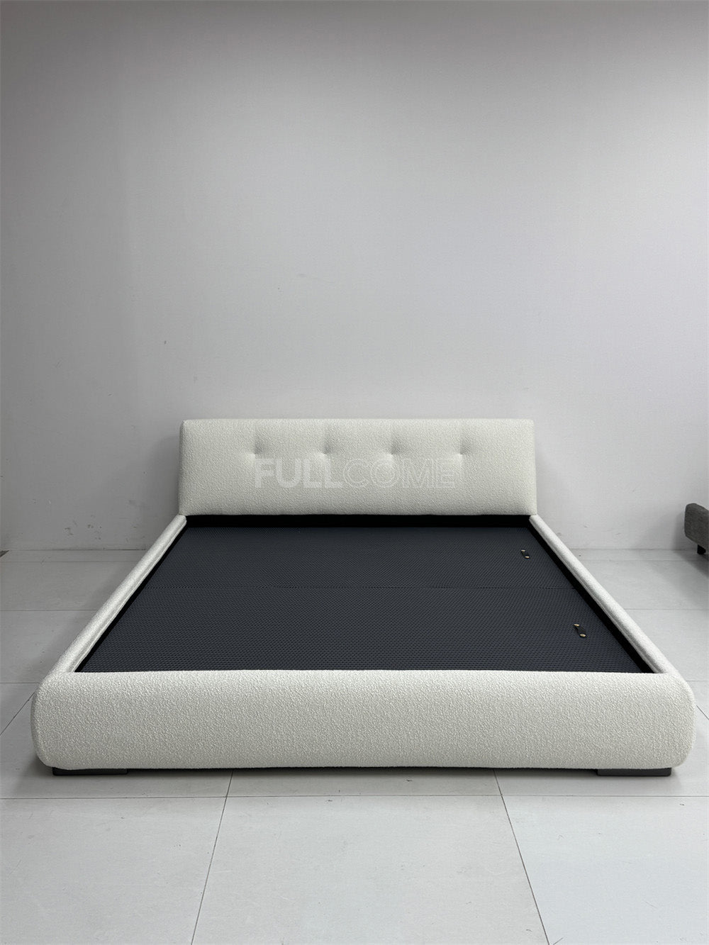 The Buttoned Boucle Platform Bed