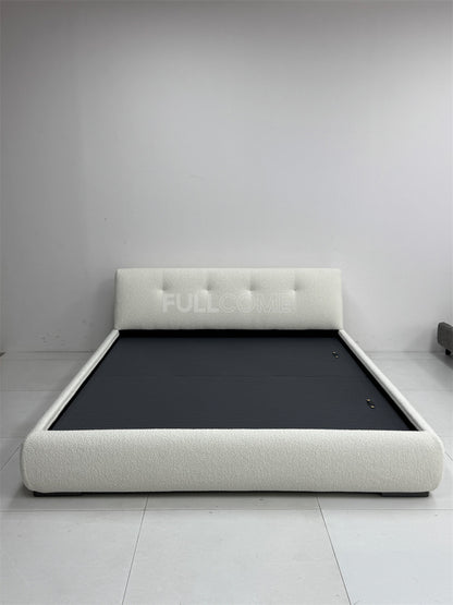 The Buttoned Boucle Platform Bed