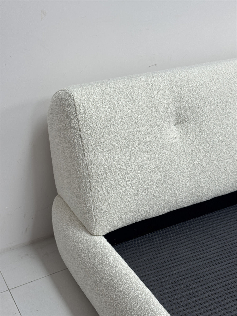 The Buttoned Boucle Platform Bed