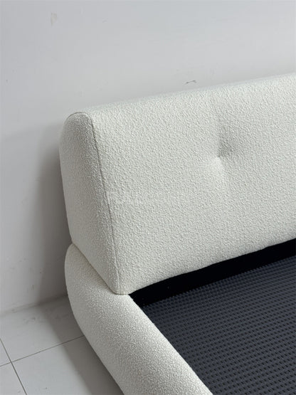 The Buttoned Boucle Platform Bed