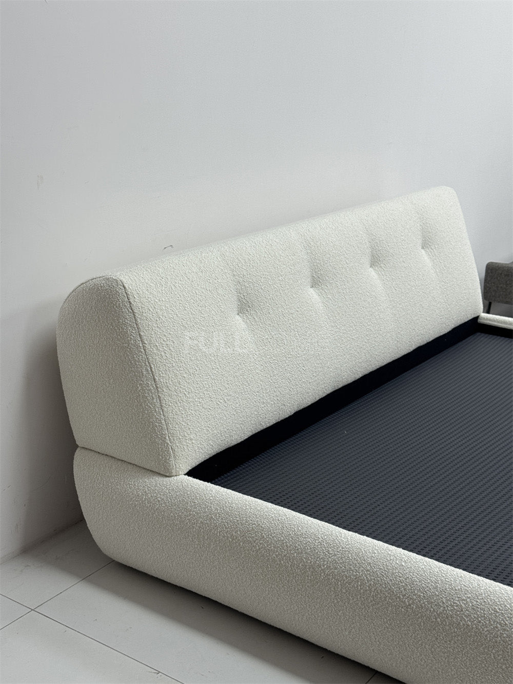 The Buttoned Boucle Platform Bed