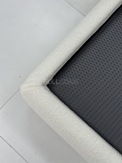 The Buttoned Boucle Platform Bed