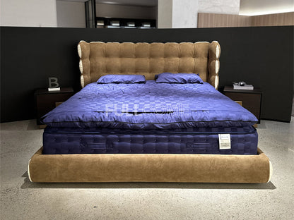 The Tufted Scroll Bed