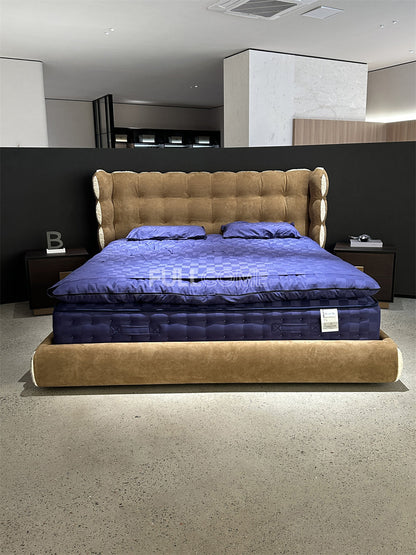 The Tufted Scroll Bed