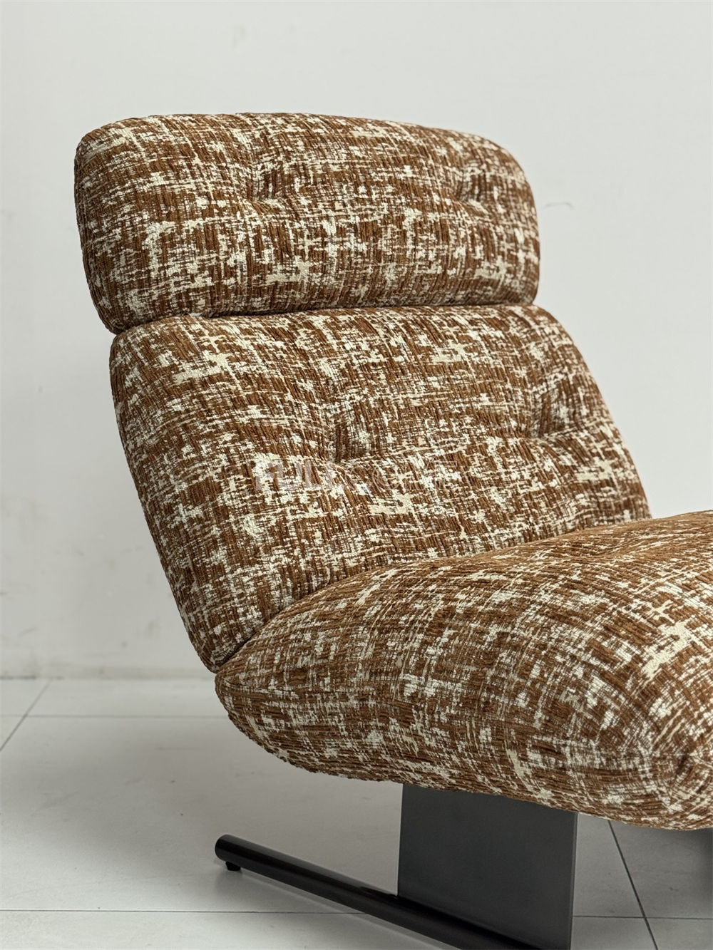 The Roll Head Lounge Chair