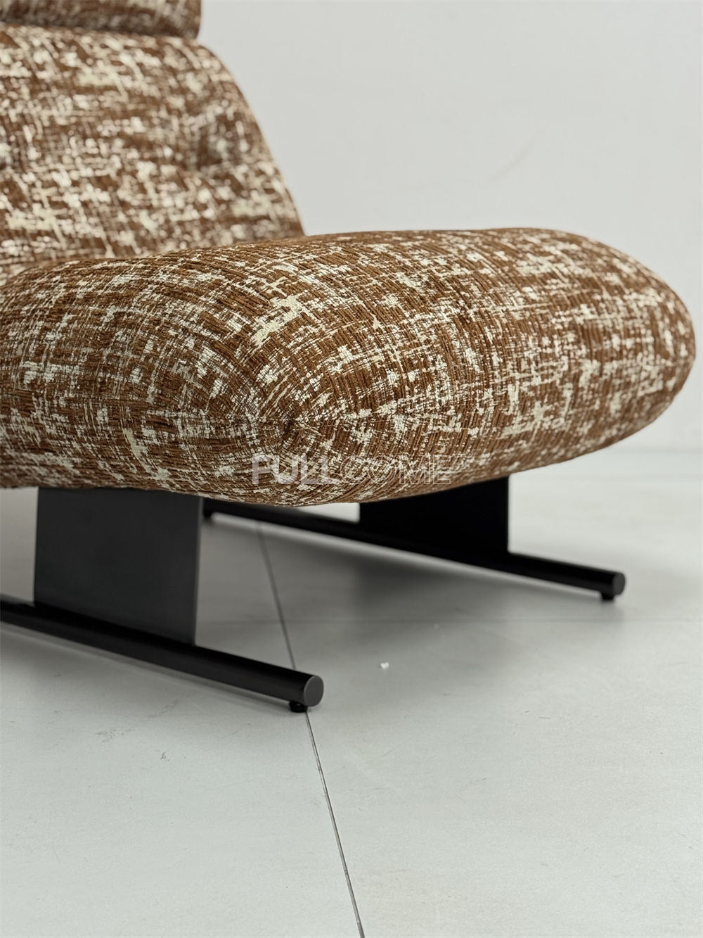 The Roll Head Lounge Chair