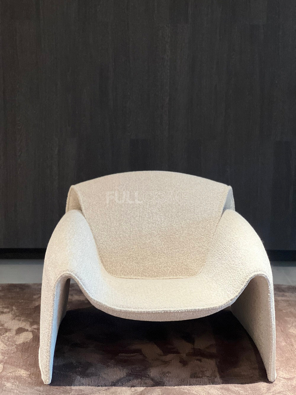 The Plunge Arm Lounge Chair