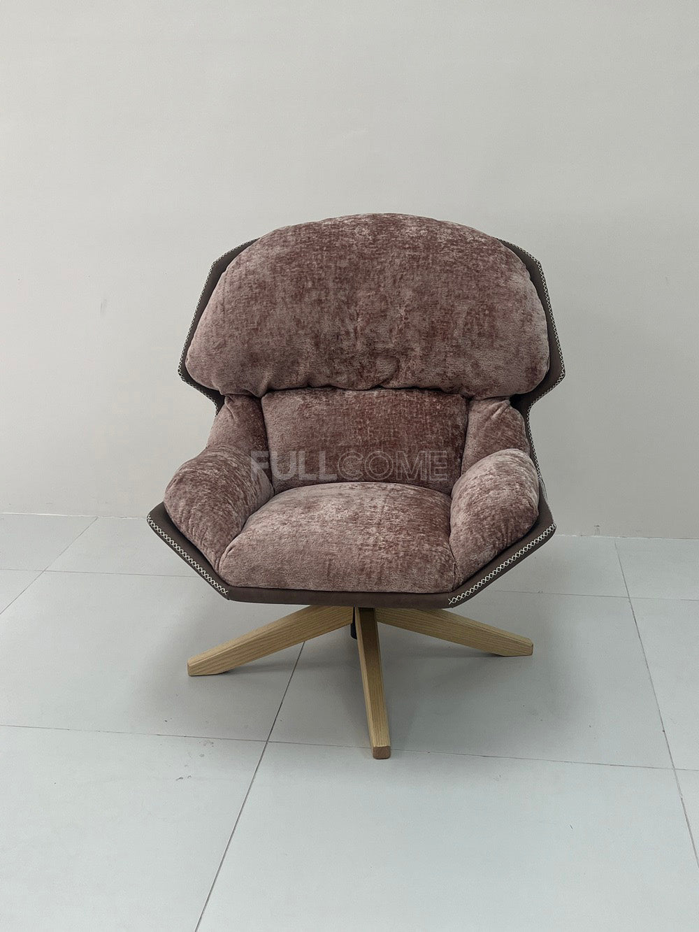 The Rivet Rim Swivel Chair