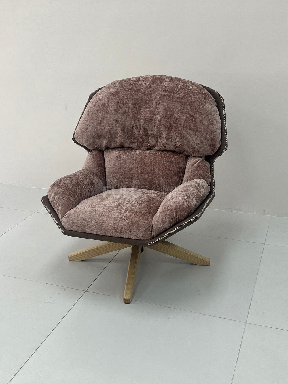 The Rivet Rim Swivel Chair