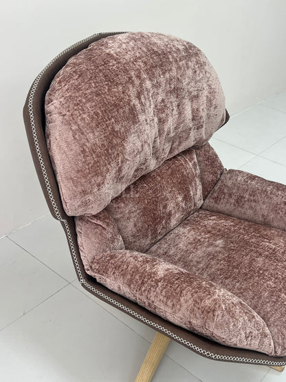 The Rivet Rim Swivel Chair